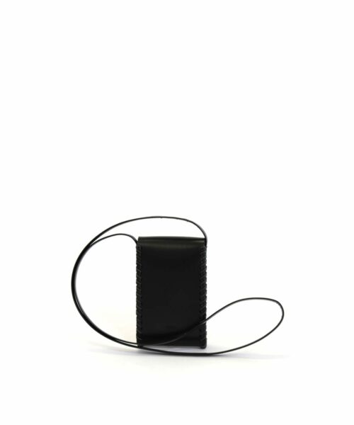LUMI Kimmo Neck Phone Case, in black, is created using natural vegetable tanned cow leather. The color will naturally change over time.