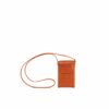 LUMI Kimmo Neck Phone Case, in cognac, is created using natural vegetable tanned cow leather. The color will naturally change over time.
