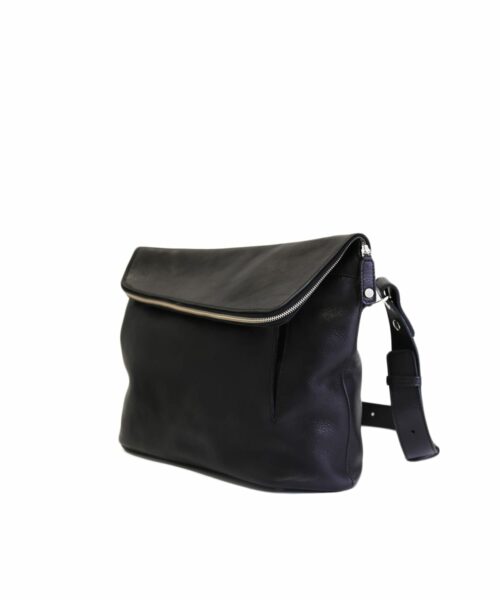 LUMI Theodore Messenger Bag, in black, is created using vegetable tanned leather.