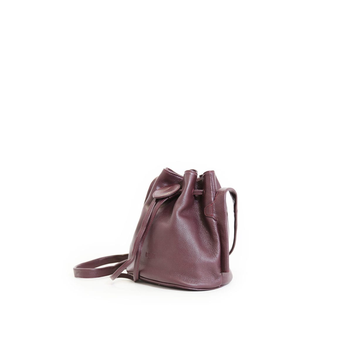 LUMI Beata Small Bucket Bag, in wine, is made of vegetable tanned goat leather.