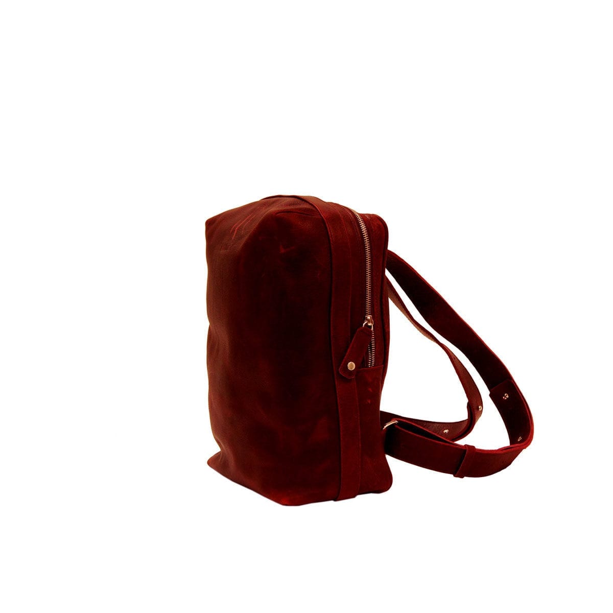 LUMI Markus Tablet Backpack, in wine, is created using vegetable tanned, pull-up waxed leather.