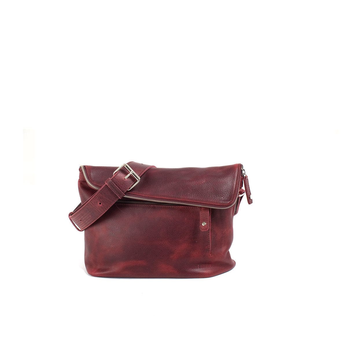 LUMI Tomi Small Messenger Bag, in wine, is all about urban functionality. Created using vegetable tanned, pull-up waxed leather.