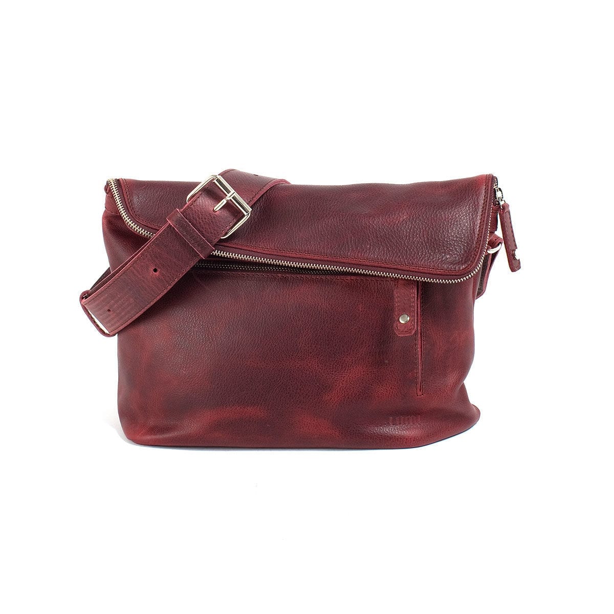 LUMI Tomi Small Messenger Bag, in wine, is all about urban functionality. Created using vegetable tanned, pull-up waxed leather.
