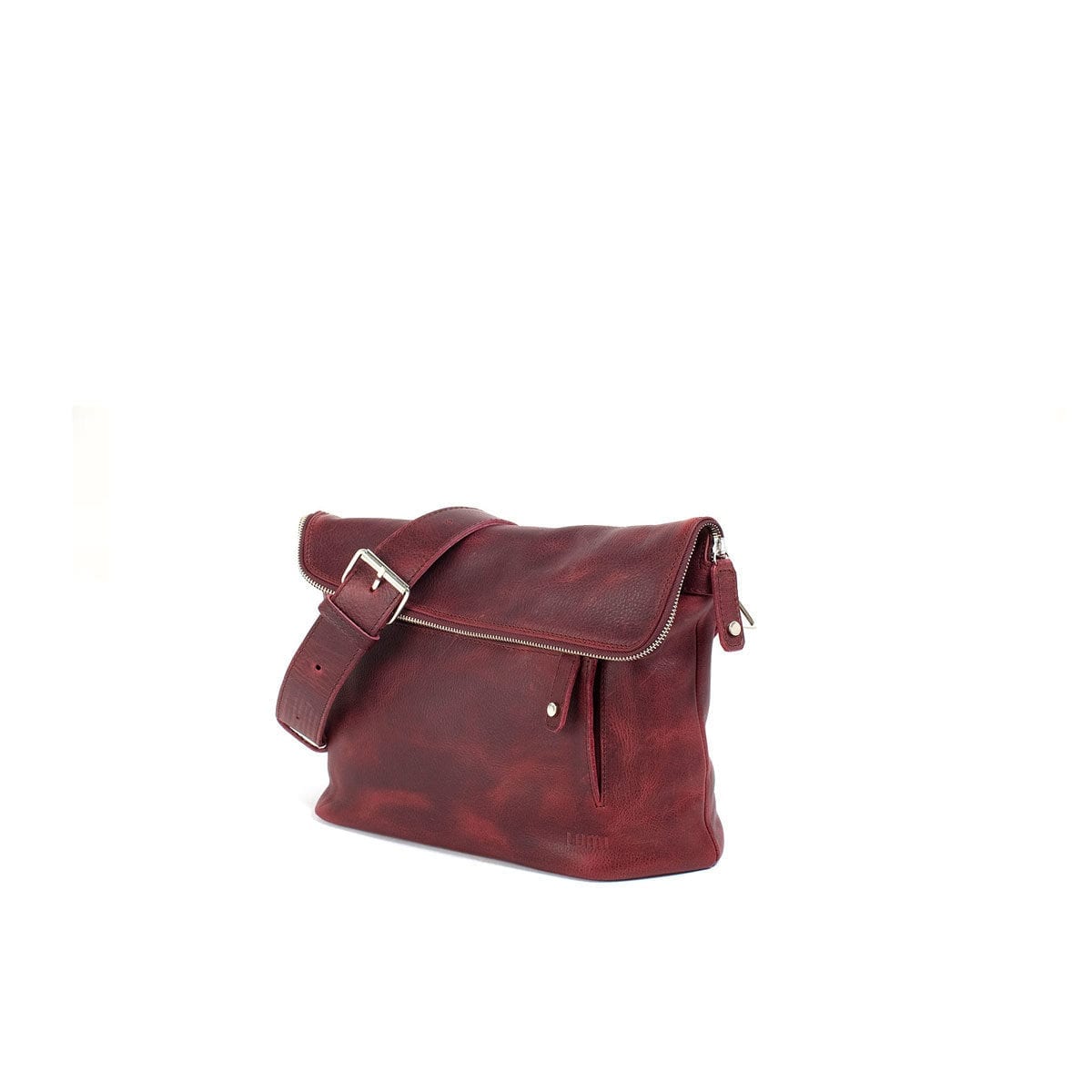 LUMI Tomi Small Messenger Bag, in wine, is all about urban functionality. Created using vegetable tanned, pull-up waxed leather.