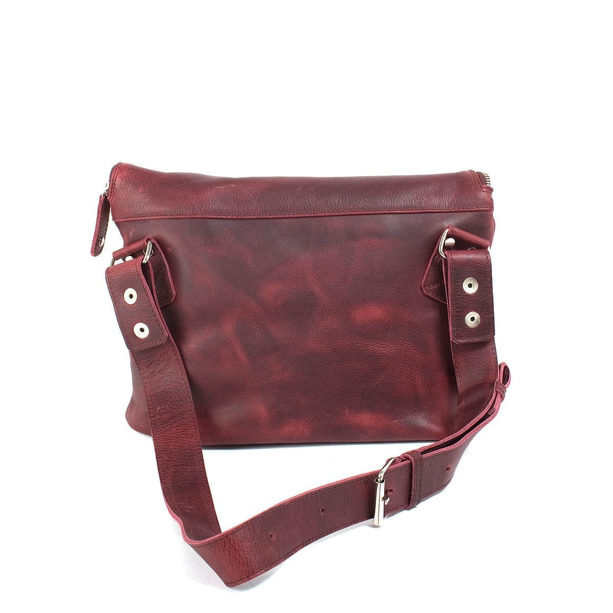 LUMI Tomi Small Messenger Bag, in wine, is all about urban functionality. Created using vegetable tanned, pull-up waxed leather.
