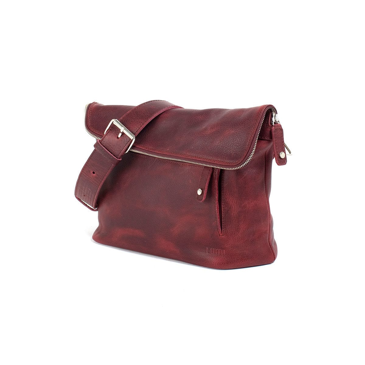 LUMI Tomi Small Messenger Bag, in wine, is all about urban functionality. Created using vegetable tanned, pull-up waxed leather.