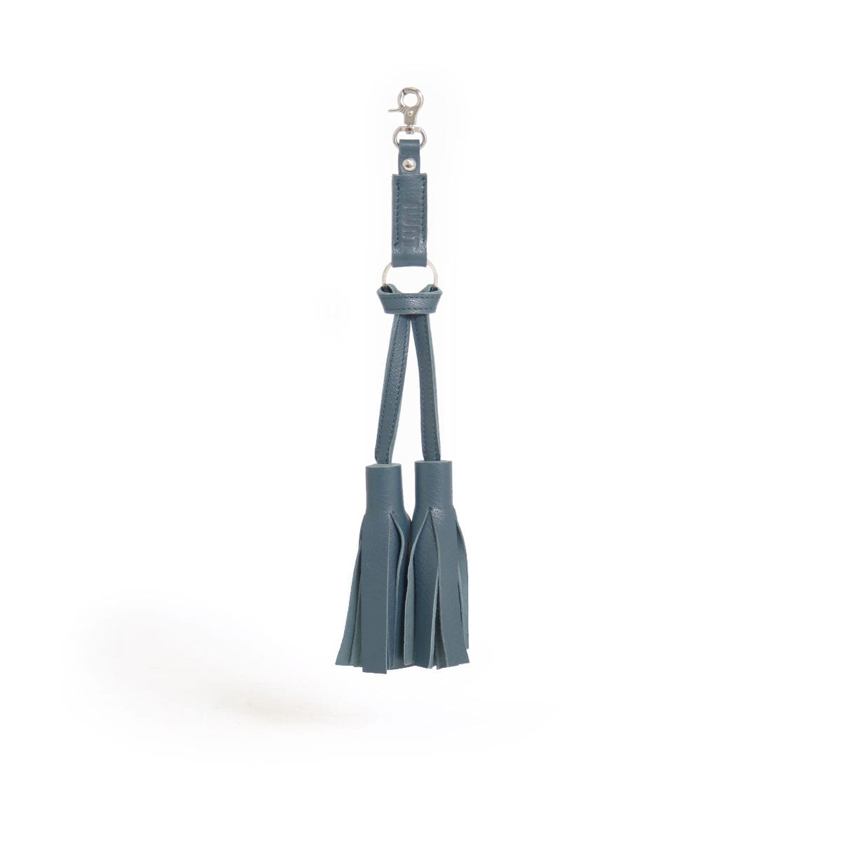 Tiia Tassel, in petrol, is made of vegetable tanned goat leather.
