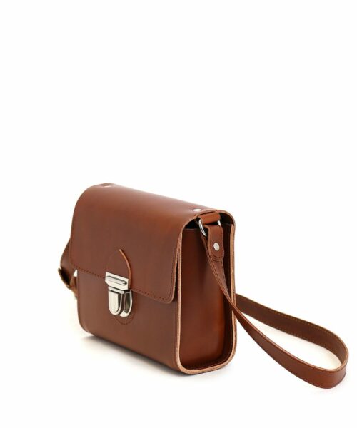 LUMI Hilla Messenger Bag, in cognac, is created using natural vegetable tanned cow leather.