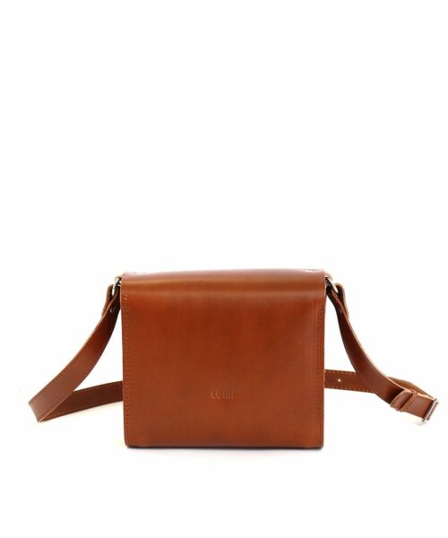 LUMI Hilla Messenger Bag, in cognac, is created using natural vegetable tanned cow leather.