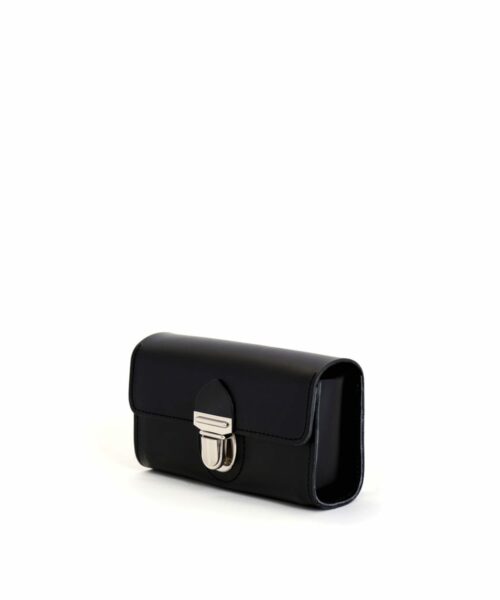 LUMI Kukka Evening Pouch, in black, is created using natural vegetable tanned cow leather. The color will naturally change over time.