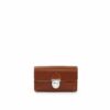 LUMI Kukka Evening Pouch, in cognac, is created using natural vegetable tanned cow leather