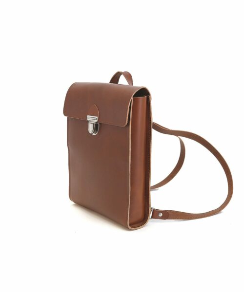 LUMI Oiva Backpack, in cognac, is created using natural vegetable tanned cow leather. The color will naturally change over time.