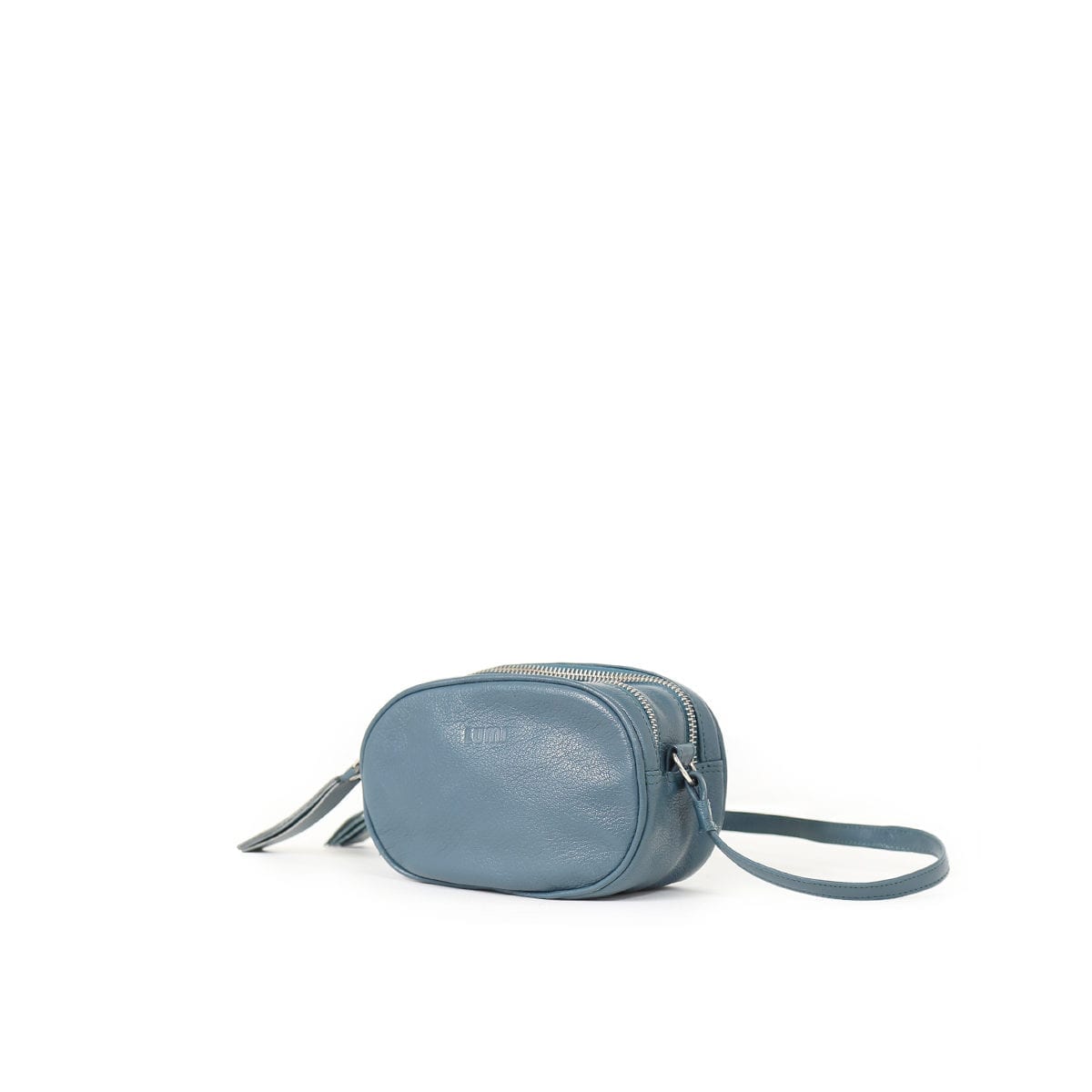 LUMI Jasmin Oval Bag, in petrol, is made of vegetable tanned goat leather. Chemical free dyeing.