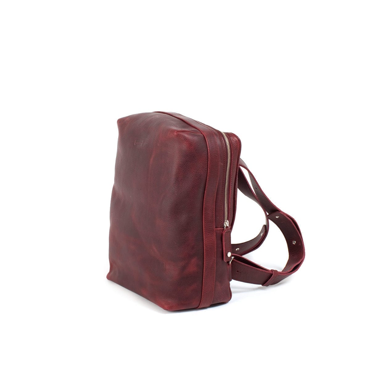 LUMI Markus Tablet Backpack, in wine. Created using vegetable tanned, pull-up waxed leather.