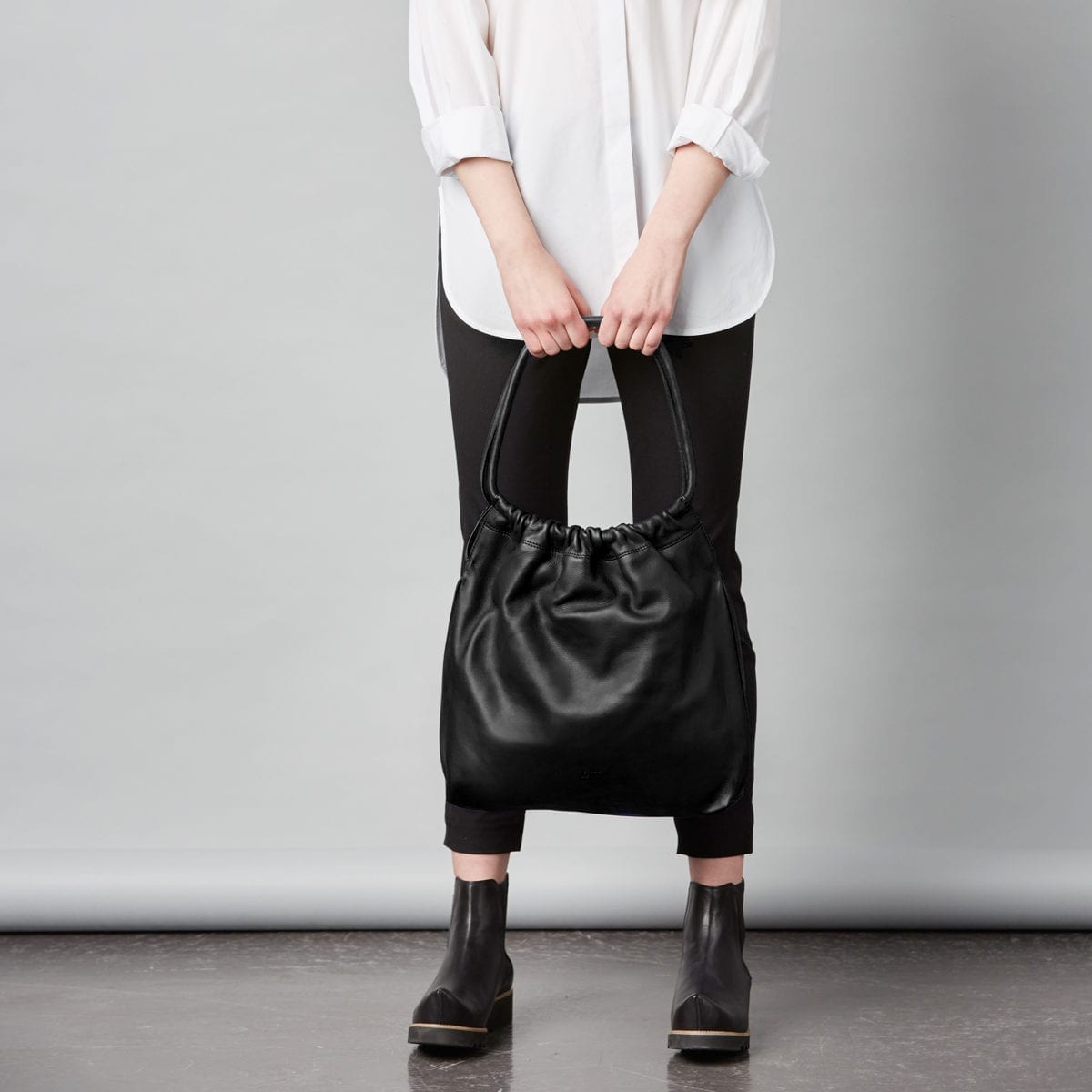 Martta Drawstring Bag in classic black.